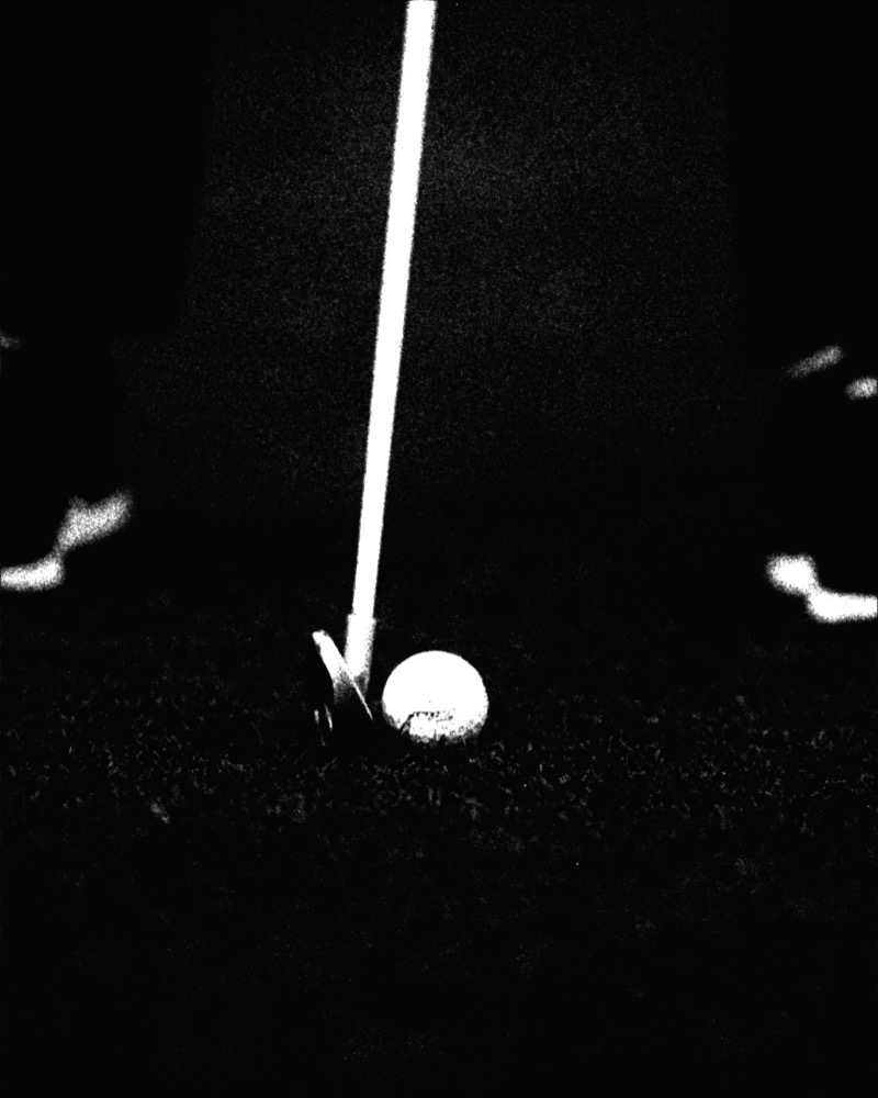 Golf ball at night in high contrast