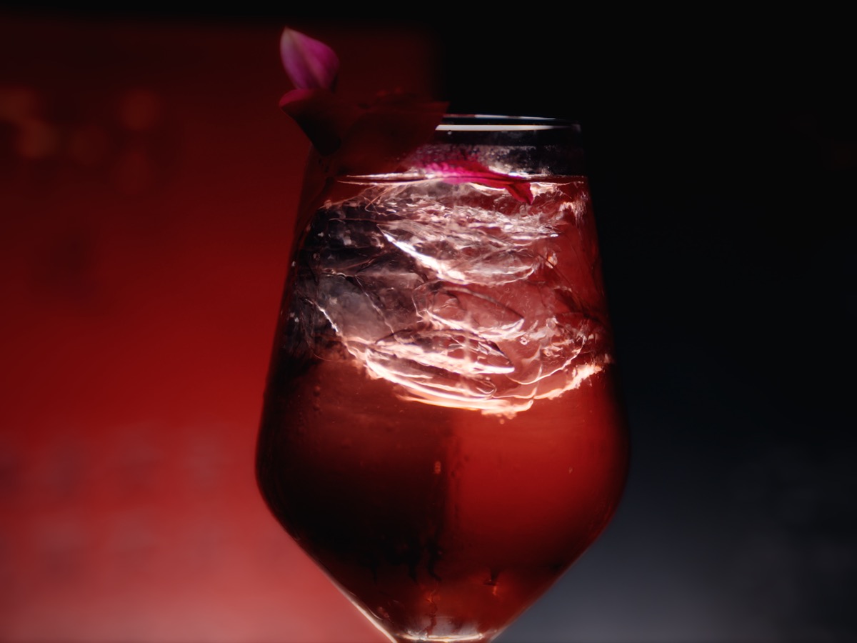 Red cocktail glass with dramatic lighting
