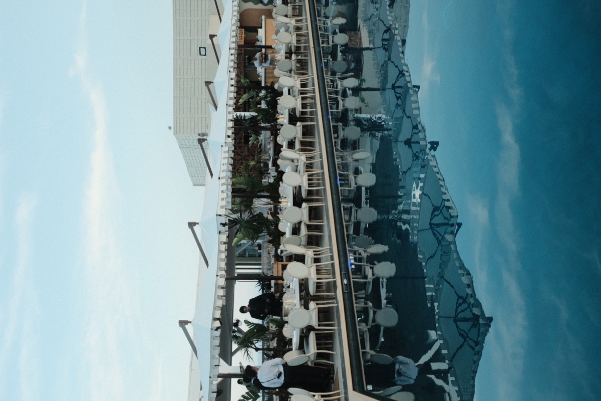 Marina at dusk with sailboat reflections