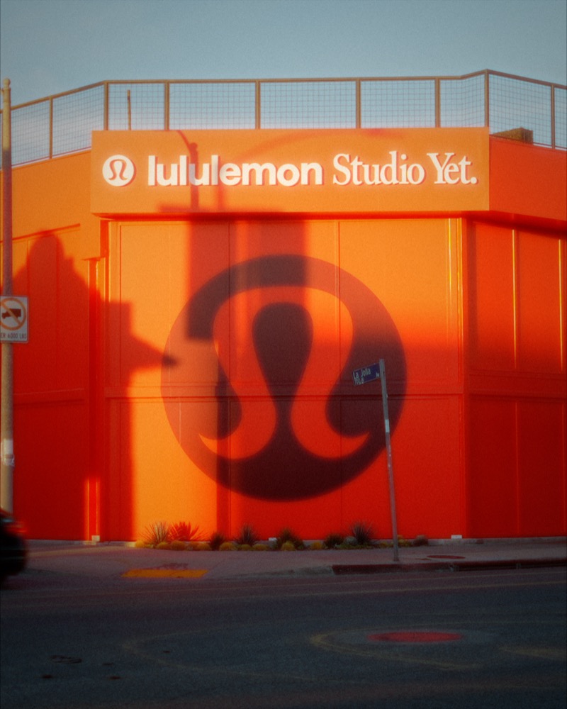 Lululemon Studio Yet exterior in orange light