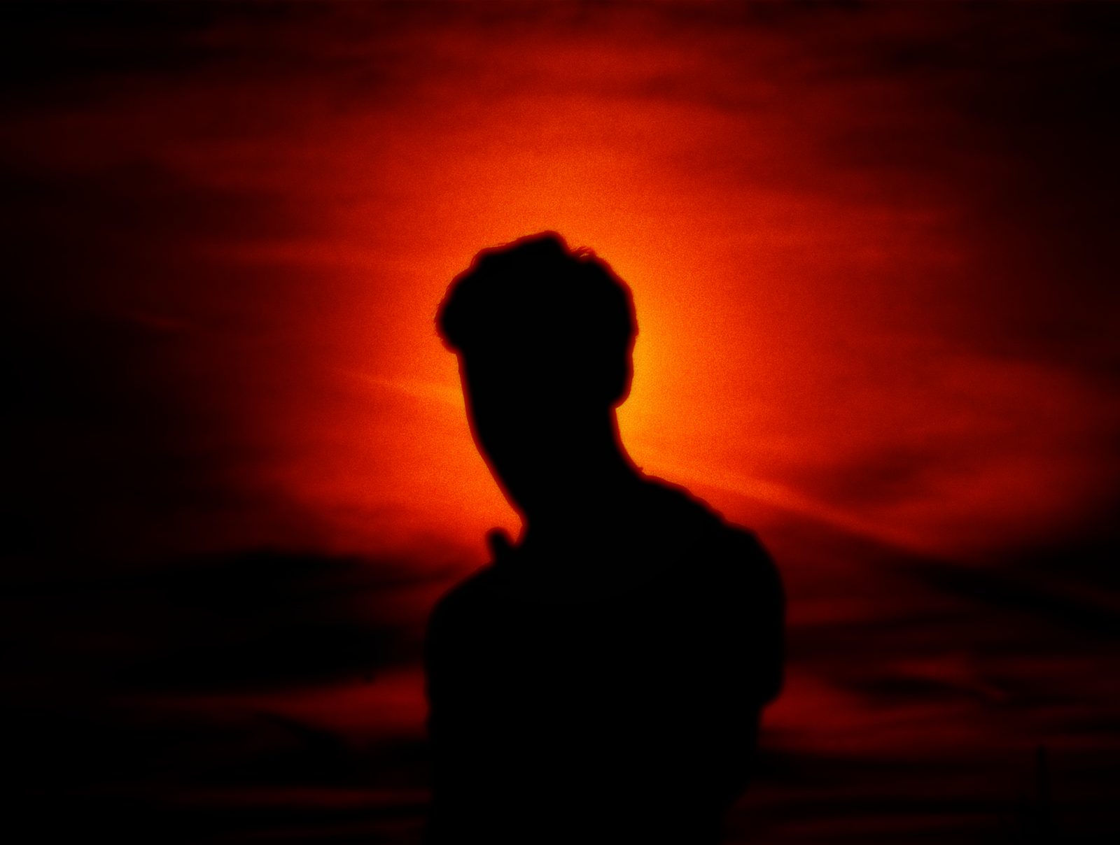 Modern building with palm trees at dusk