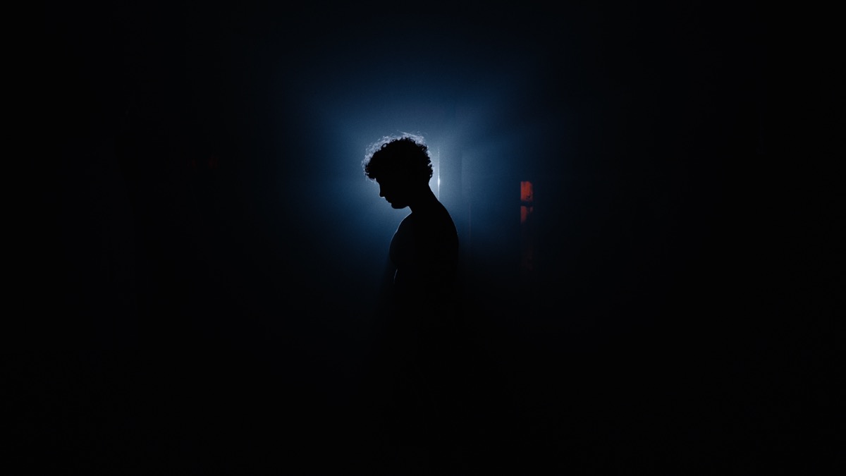 Silhouette in dramatic blue backlight